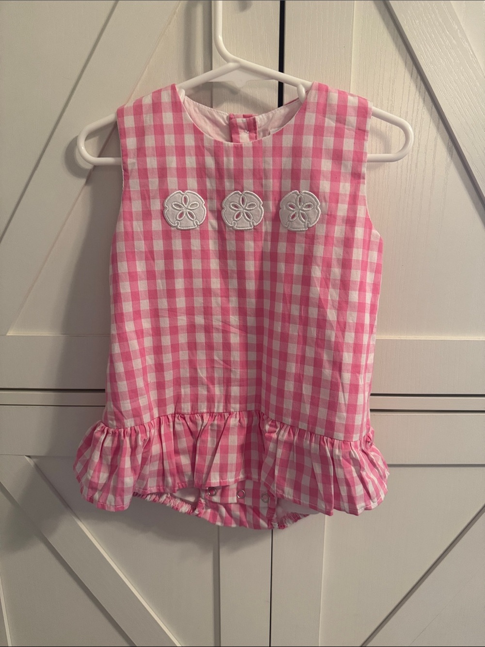 Pink Gingham Ruffle Skirt Romper with white sand dollars embroidered